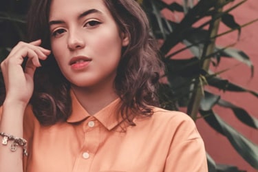 image of a woman with polo shirt on