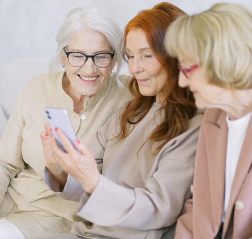 3 women video chatting on a phone